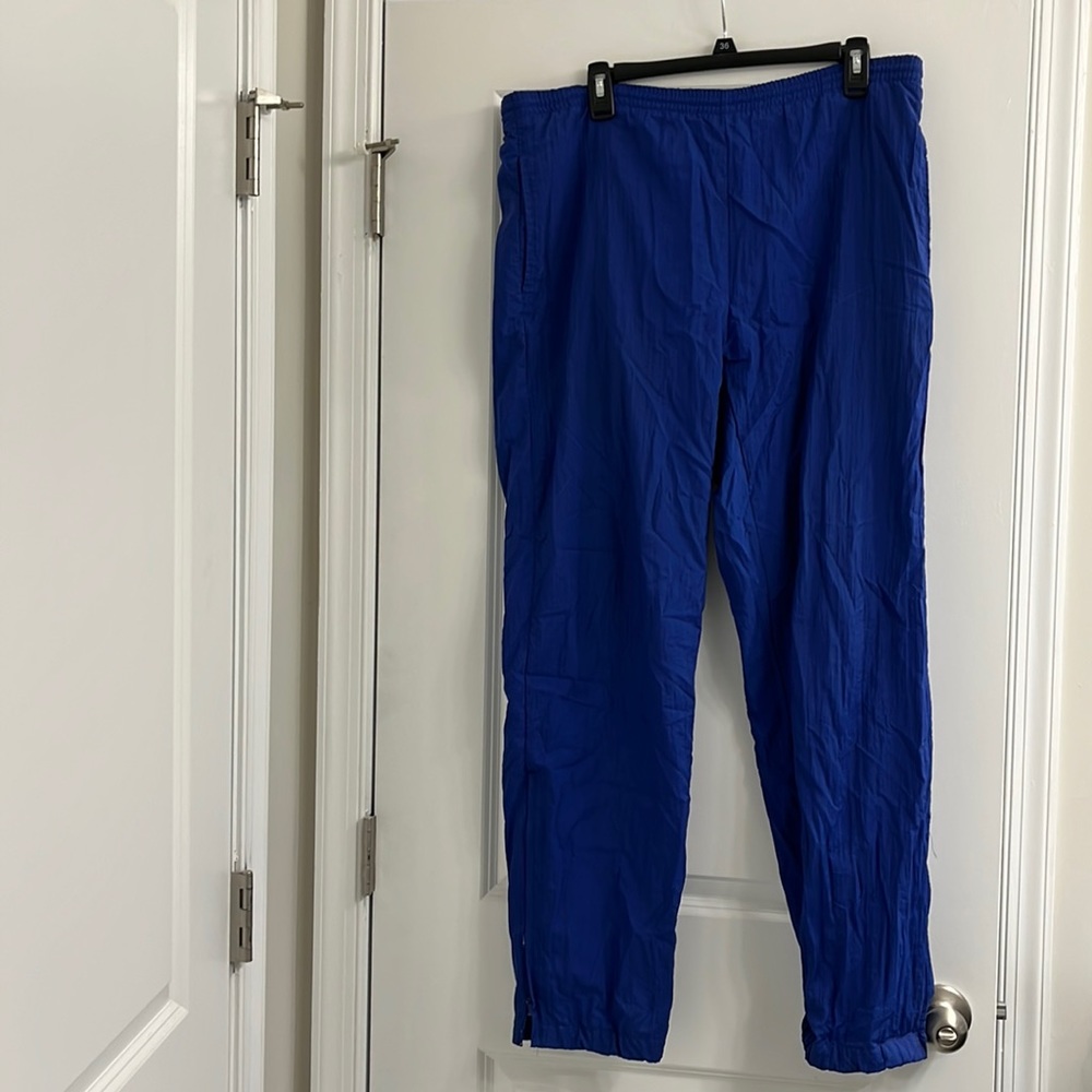 Dark blue wind breaker pants with draw string waist.